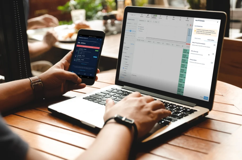 Visual representation of employee time tracking software on a laptop screen someone is clicking the keypad for