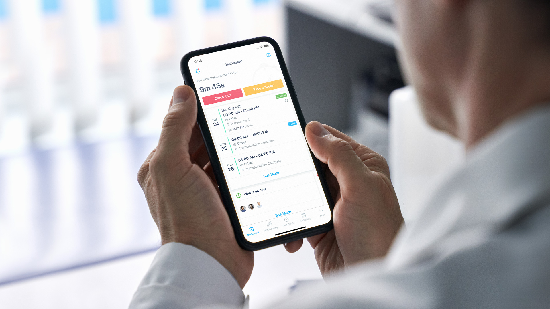 Manager looking at a mobile employee schedule