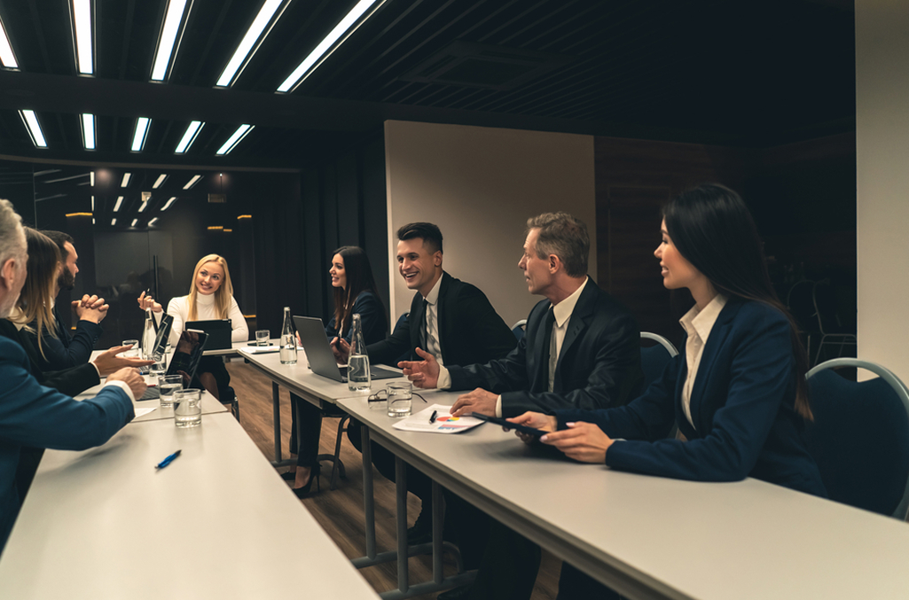 A board of municipal leaders discussing how to improve employee time tracking for government